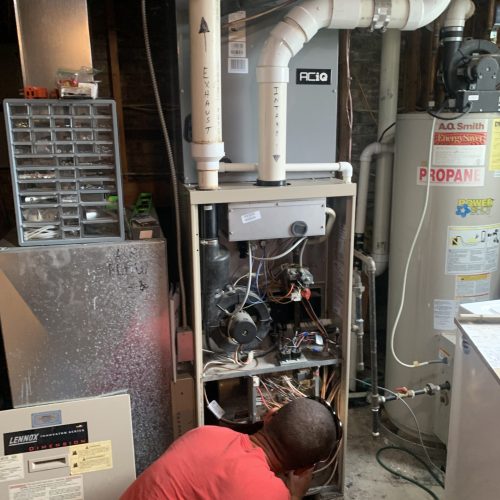 hvac direct technician installing furnace in Cobb County
